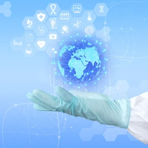 Hand in Handschuh h&auml;lt Weltkugel